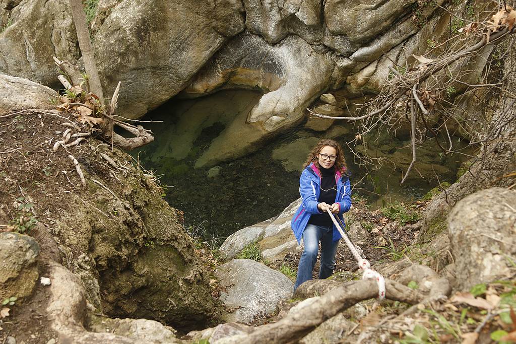 Devil's Bridge hike Troizina - strategically positioned ropes help you climb down and back up